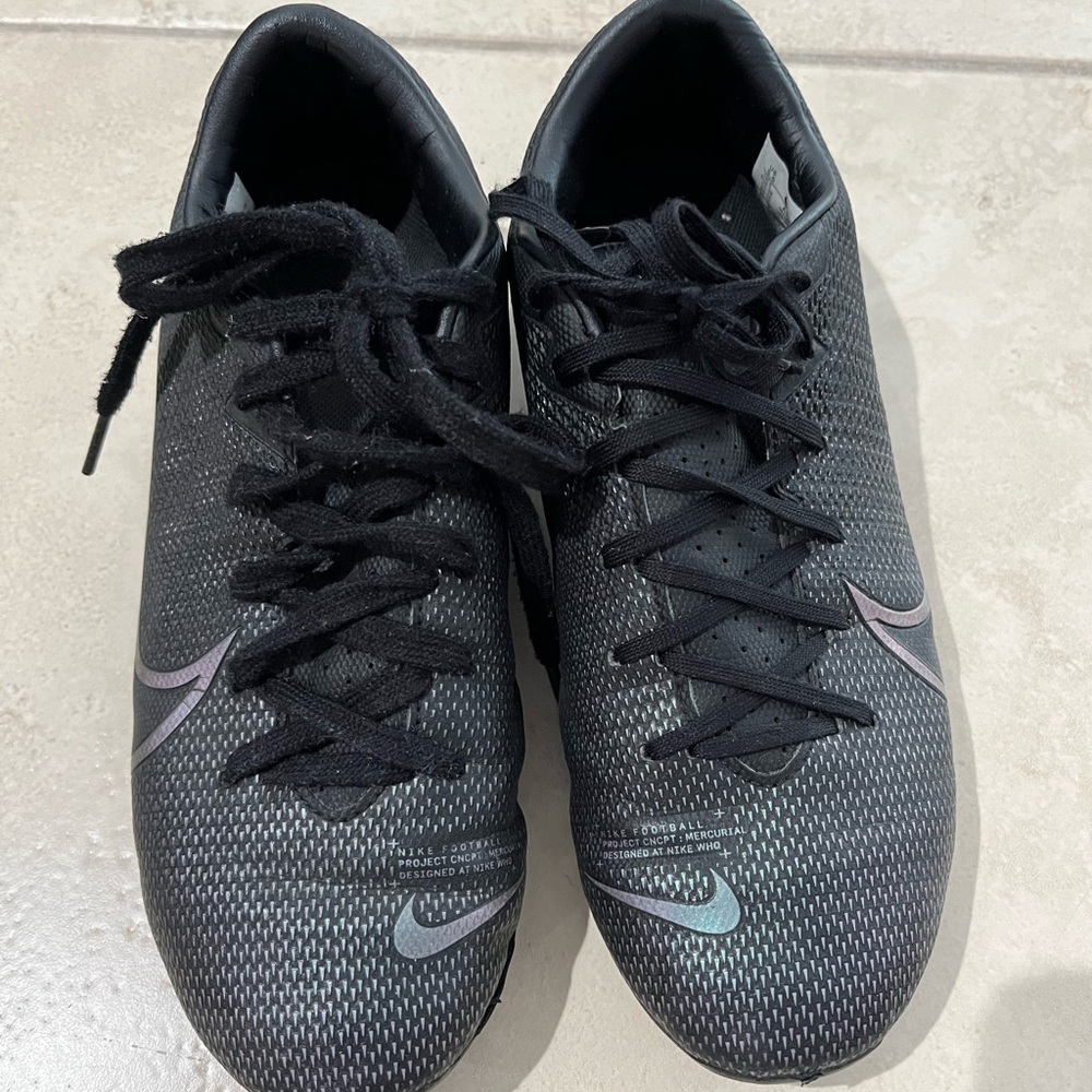 Nike Mercurial-Boy’s Black Soccer cleats with Iridescent Swoosh